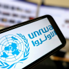 Logo of UNRWA on a phone